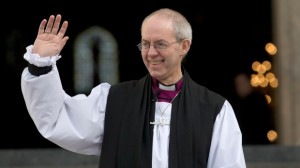The new Archbishop of Canterbury, Justin Welby, waves outside St Paul's Cathedral as he poses for the media following his ceremony known as the confIrmation of election in London, Monday, Feb. 4, 2013. (AP / Alastair Grant)