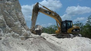 Bulldozers were used to extract crushed rock for a road-building project. Photo: AP