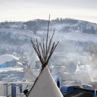 CANNON BALL, NORTH DAKOTA - DECEMBER 3: Fires create early morning smoke at Oceti Sakowin Camp on the edge of the Standing Rock Sioux Reservation on December 3, 2016 outside Cannon Ball, North Dakota. Native Americans and activists from around the country have been gathering at the camp for several months trying to halt the construction of the Dakota Access Pipeline. The proposed 1,172-mile-long pipeline would transport oil from the North Dakota Bakken region through South Dakota, Iowa and into Illinois. on December 1, 2016 in Cannon Ball North Dakota, Colorado. (Photo by Helen H. Richardson/The Denver Post)